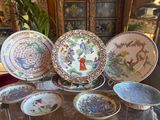 a lot of plates that are sitting on a table