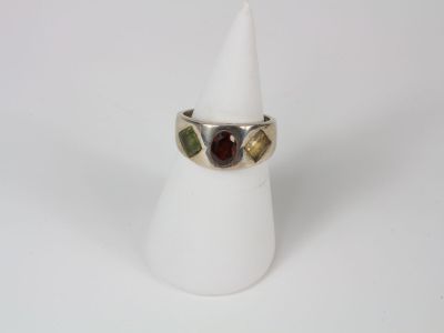a close up of a ring on a white napkin