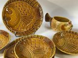 many bowls and plates that are sitting on a table