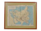 framed map of asia in a wooden frame on a white background