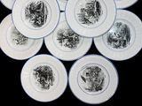six plates with black and white designs on them