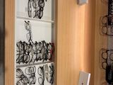many glasses on the shelves in the room