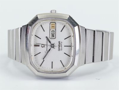 an image of a close up of a wrist watch on a white surface