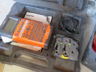 an orange calculator sitting in a case on the floor