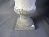 a white vase that is sitting on a table