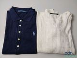 two polo shirts sitting next to each other on a table