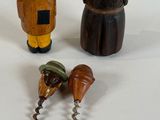 three wooden figurines that are next to each other