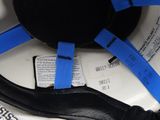 a toilet with a seat belt and a seat belt on it