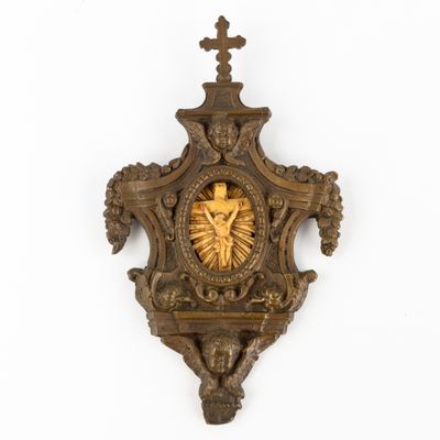 a clock on the wall with a cross on it