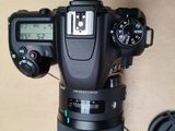 a camera that is sitting on a table next to a mouse