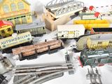 many different types of toy trains on the table