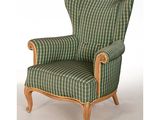 an upholstered chair with a green and white striped upholstered seat