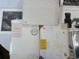 a lot of old postcards on the table