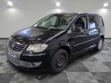 a picture of a black van parked in a garage