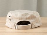 a white hat with a star on it sitting on a table