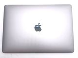 an apple logo on the back of an apple laptop