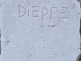 concrete block with the word depree carved into it