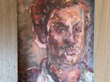 painting of a man with a cigarette in his mouth in a wooden frame