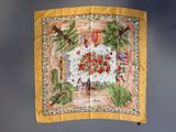 an image of a yellow scarf with a picture of flowers and birds on it