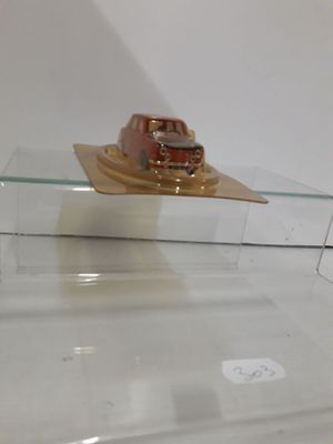 a small boat that is sitting on top of a glass shelf