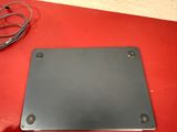 an image of a laptop computer sitting on top of a red table