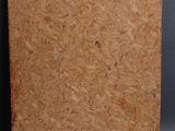 a piece of cardboard on a table with a black background