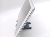 a white tablet computer sitting on top of a stand