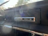 a close up of a car ' s emblem on the hood