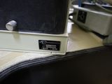 a close up of a guitar case on a table