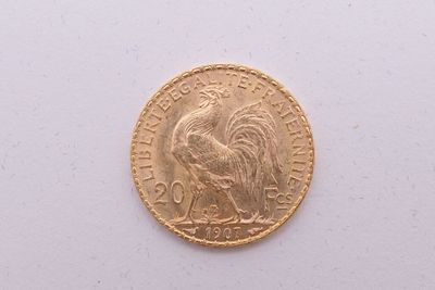 l'image d'une pièce d'or ornée d'un coq