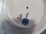 a white plate with a blue and white design on it