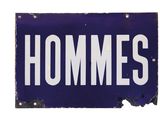 an image of a blue and white sign with the word hommes