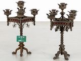 pair of antique metal candelabs with ornate designs