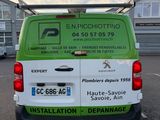 the back of a green van parked in a parking lot