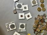 a lot of coins that are on the table