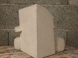 a stone block sitting on top of a wooden table