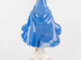 a figurine of a woman in a blue dress