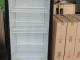 a refrigerator that is sitting in the middle of a room