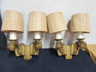 three lamps that are sitting on a black table