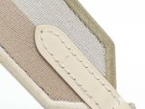 a close up of a purse with a keychain on it