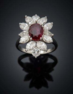 an oval ruby and diamond cluster ring