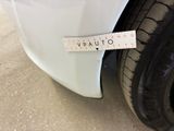 a sticker on the side of a white car