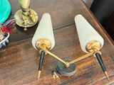 two lamps that are sitting on a wooden table