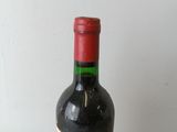 a bottle of wine that is sitting on a table