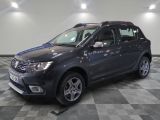 a picture of a grey dacia parked in a garage