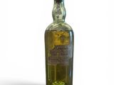an image of a bottle of alcohol sitting on a white surface