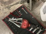a tool bag that has tools in it on the floor