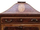 a small wooden cabinet with two drawers and a clock on top
