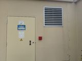 a door to a building that has a sign on it