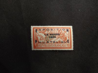 a close up of a stamp on a black cloth
